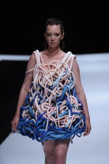 model in multicoloured pipe wired garment