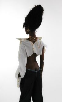 Model shown from behind with white studio background