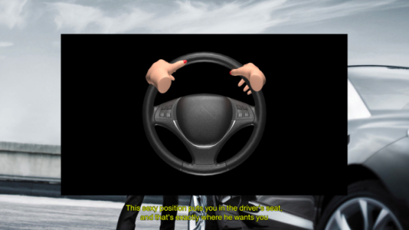 Steering wheel overlaid on background of car with female hands on the wheel.