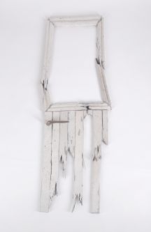 pale wash broken wood artefact with small handle