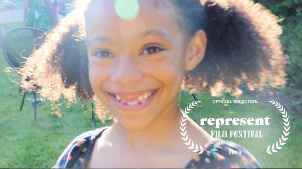 Film still of girl smiling