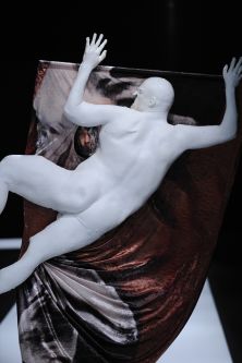 artefact sculpture of a naked man lying on a draped cloth