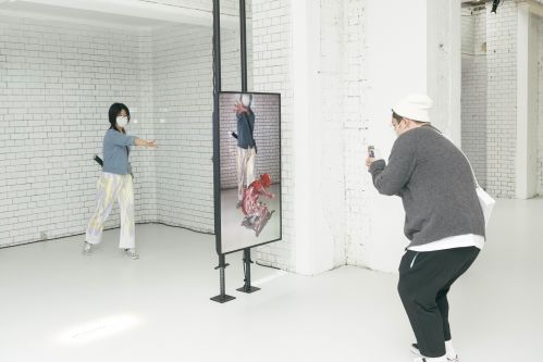 People taking photos of virtual reality 