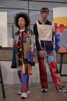 Two models standing in colourful clothing