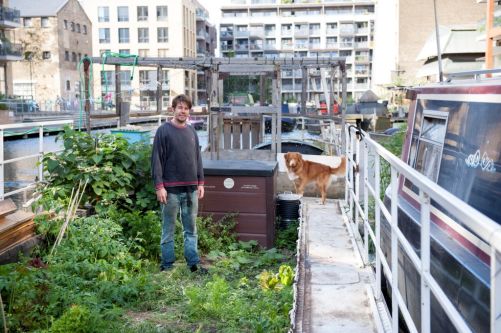  man stood by his canal boat 