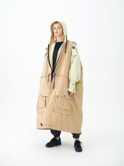 Female model in cream coloured oversized coat
