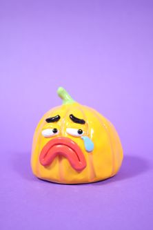 Ceramic pumpkin with a sad face