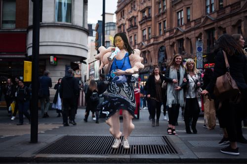 model on highstreet wearing a bodysuit garment with disfigured limbs