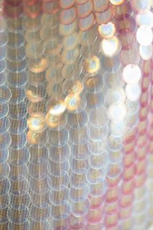 Sequins embroidered onto hanging textile