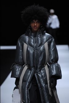 Male model wearing puffy jacket designed by Tzubin Cheng