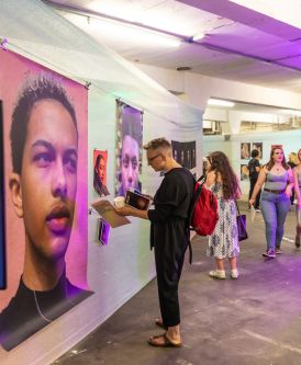 Guests look at the artwork