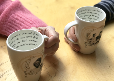 Close-up of hands holding mugs