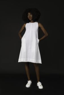 model wearing white dress
