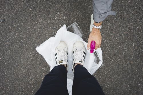 trainers being sprayed with bleach