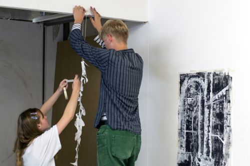 Students putting up exhibition.