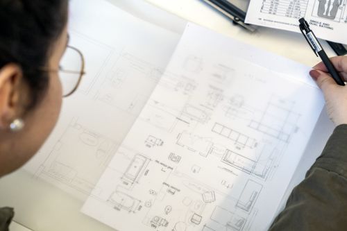 Student working on a technical drawing.