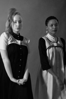 Blonde and brunette models wearing reversible black and white shirt dresses