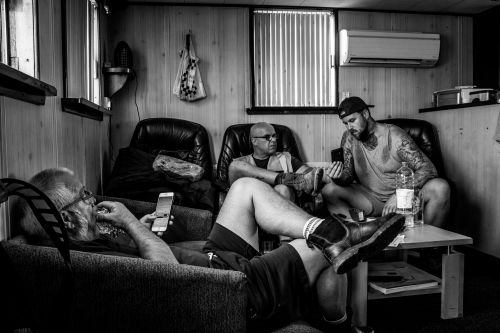 men relaxing on sofas