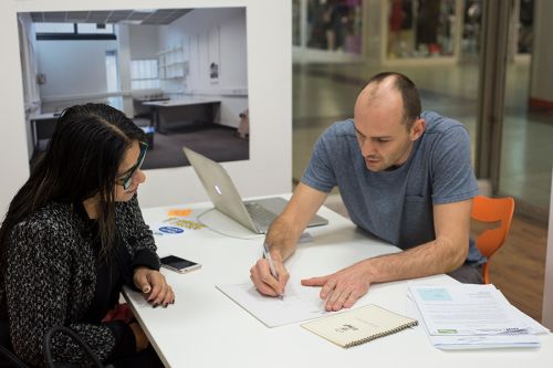 Designer Francisco and Nanci, the Castle Shop’s owner, exploring options for her new logo.