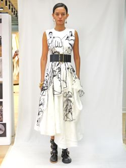 Woman wearing dress on catwalk