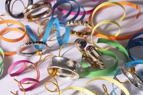 Work by Visual Merchandising - Interiors students, taken by Sarah Manning. Silver and gold rings sat among bright coloured ribbons and gold wire.