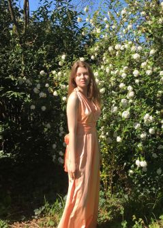 Sophie de grappling wearing a pink dress