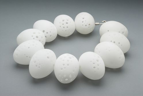 Sarah King's jewellery design, egg shaped balls with holes necklace.