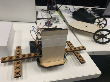 robot being programmed with laptop