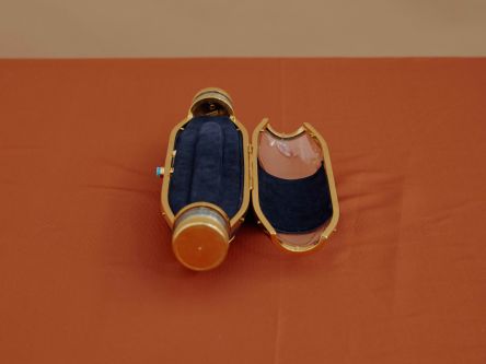 A gold casing bottle