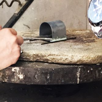 Shaped silver ready to be heated.