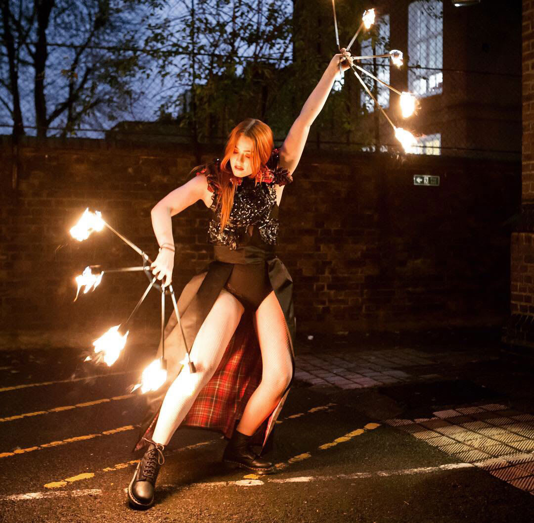 Fire dancing and hula hoops with costume and styling