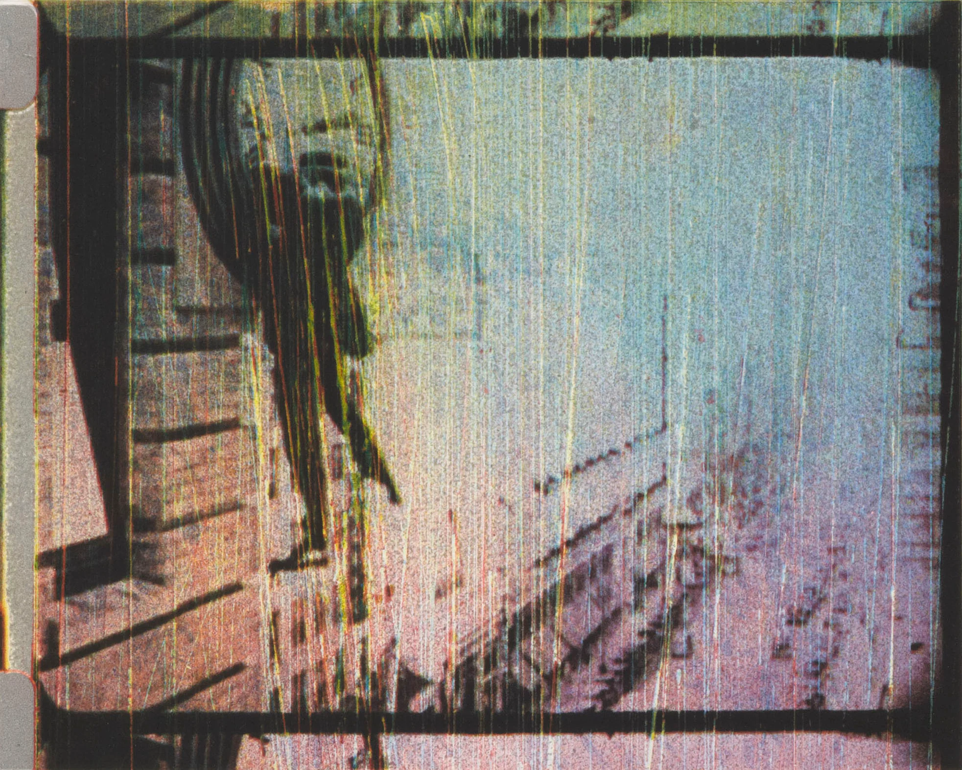 Blurred white and grey image with the outline of a dark clock on the left 