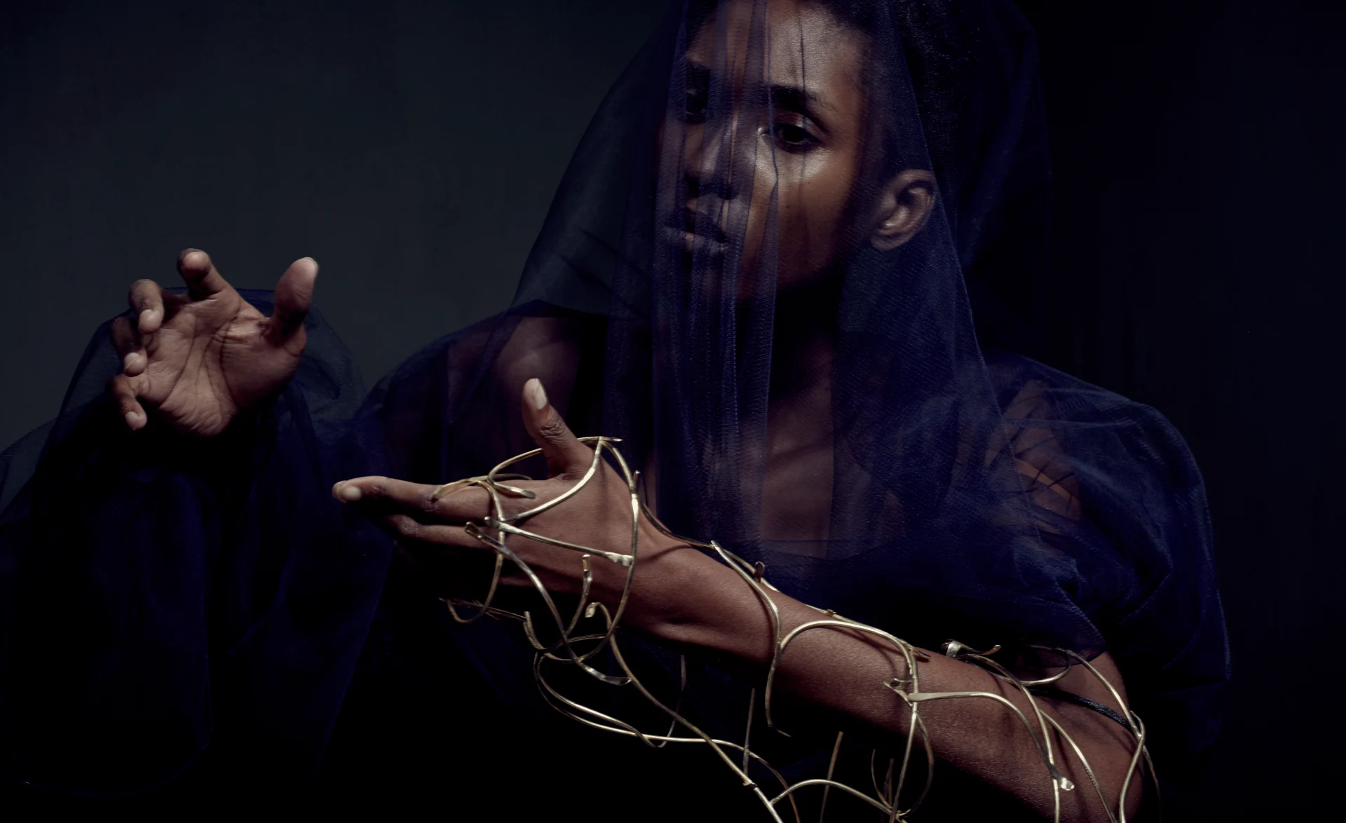 Female model with gold jewellery on her wrist