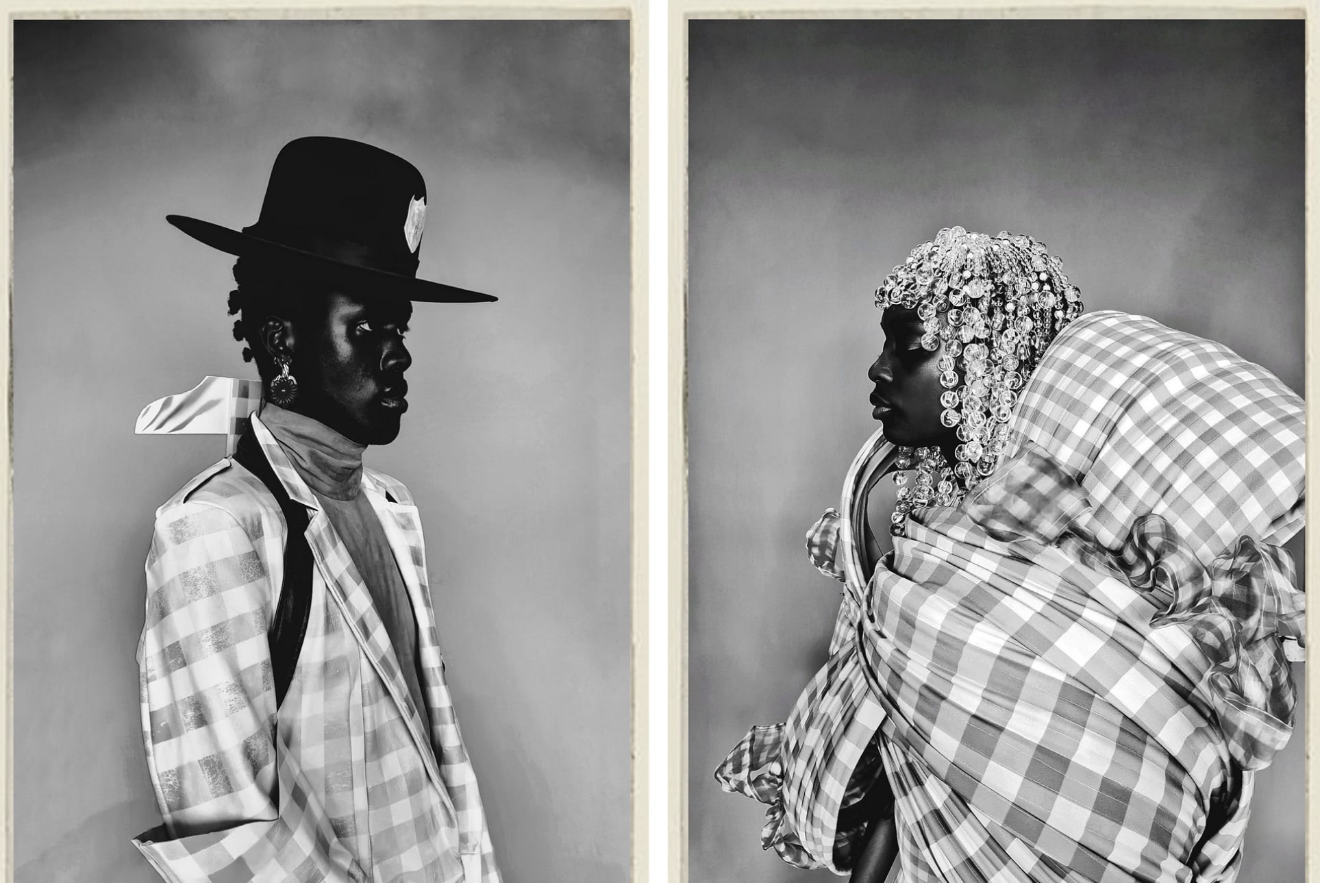 A person wearing a hat facing another person. Both are wearing garments made from a checked material. 