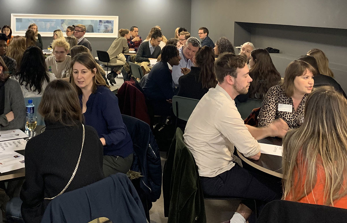 Students and guests chat over tables in LCC's Typo Cafe.
