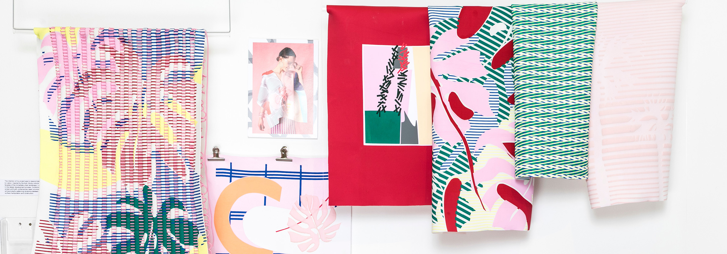 Selection of textile designs in reds, pinks and greens. 