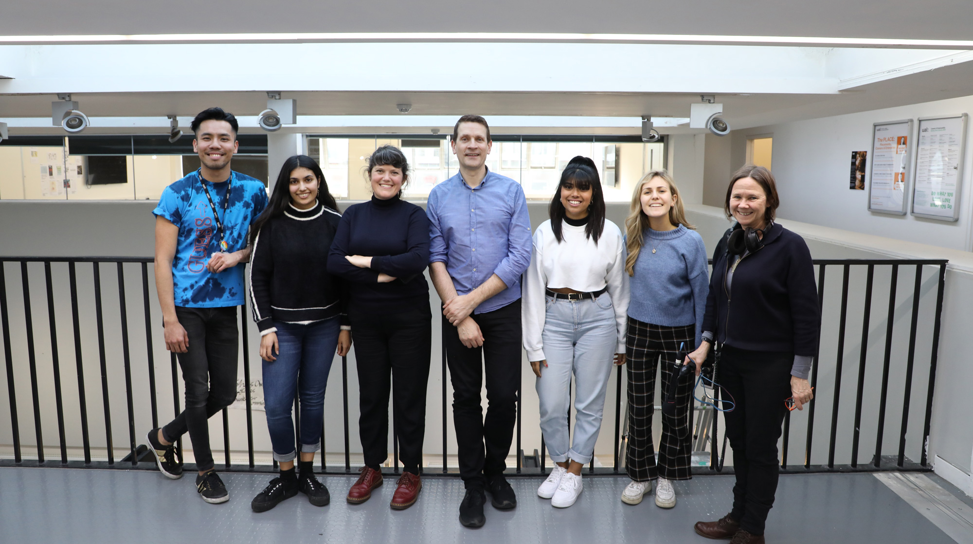 Posed group photo of Bruce Daisley with BBC producer and LCC students smiling at camera