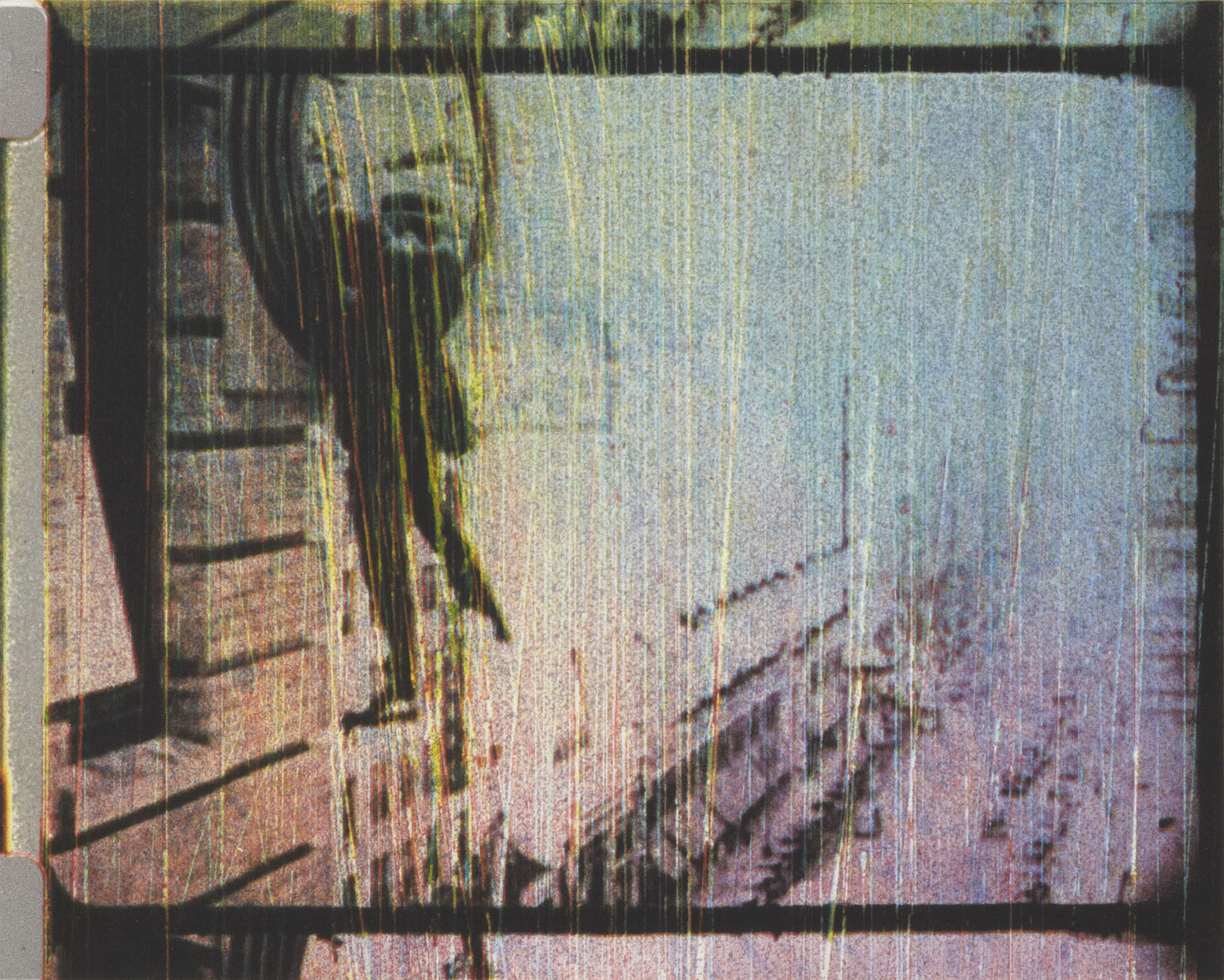 Blurred white and grey image with the outline of a dark clock on the left 
