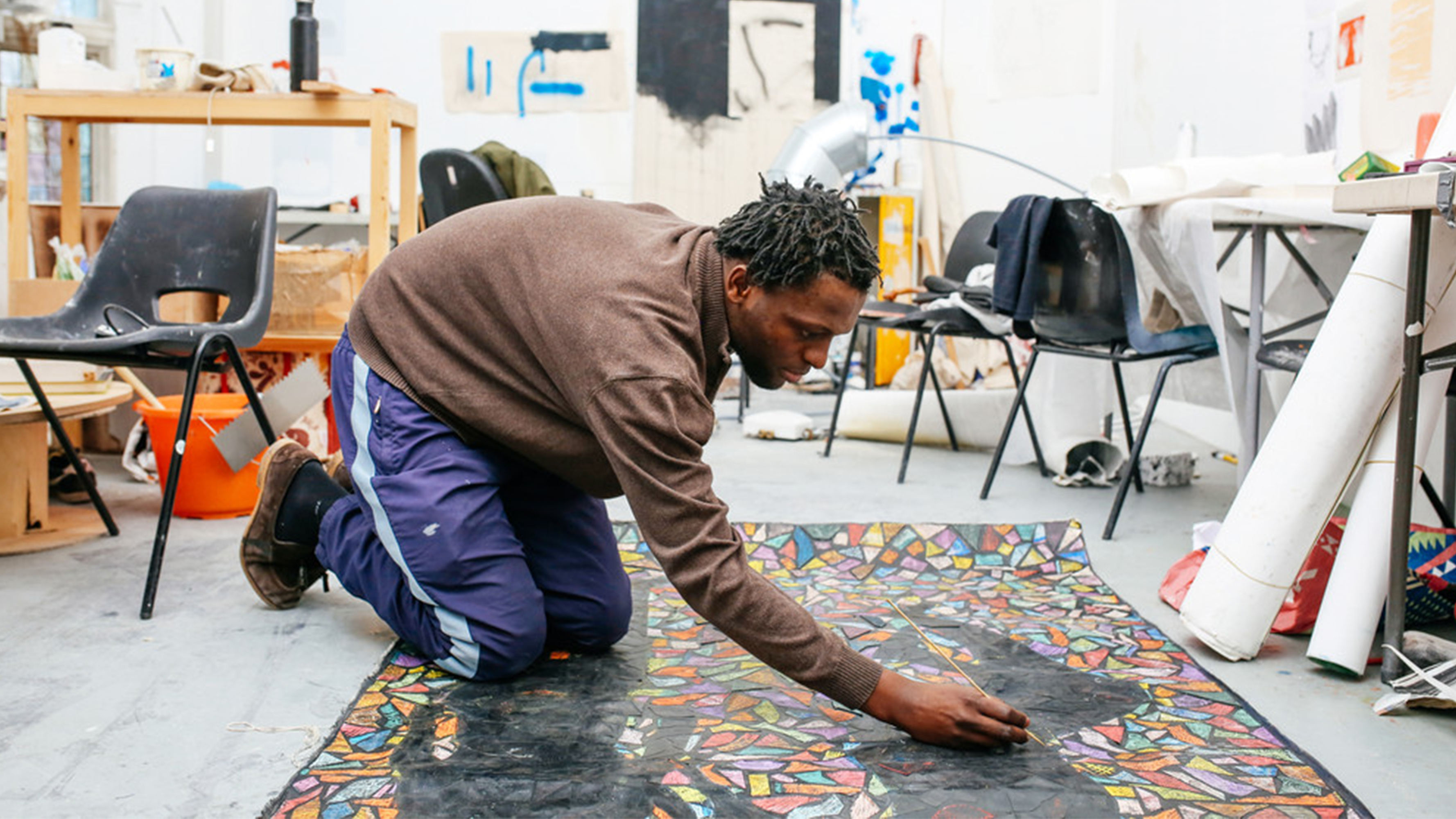 Students on the floor painting