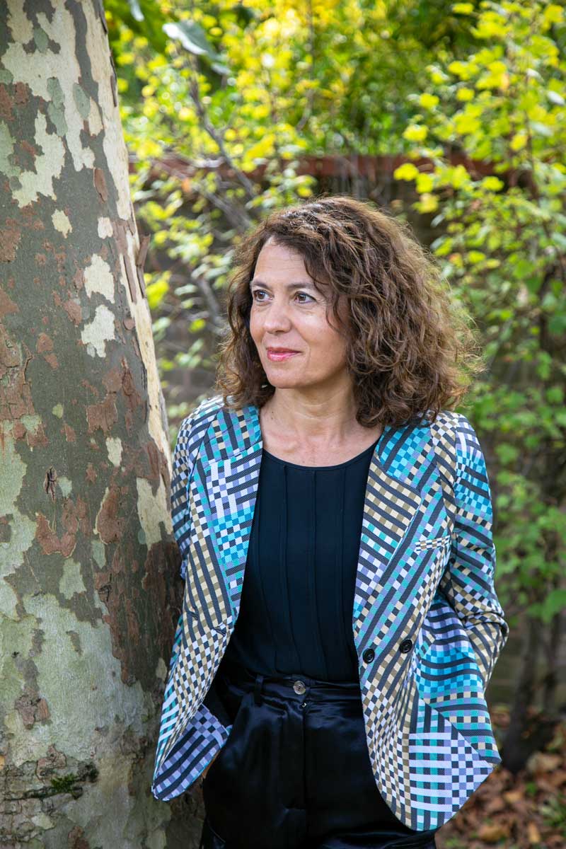Outdoor portrait shot of person against green background
