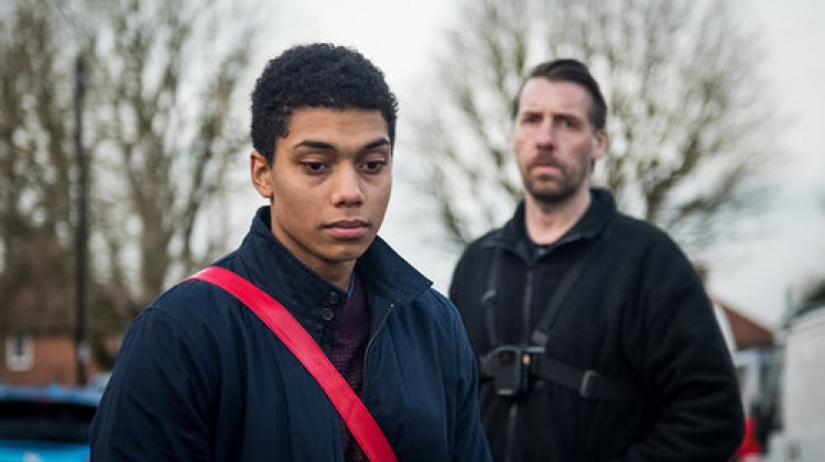 Still from the film Killed by my Debt, featuring the main and supporting character