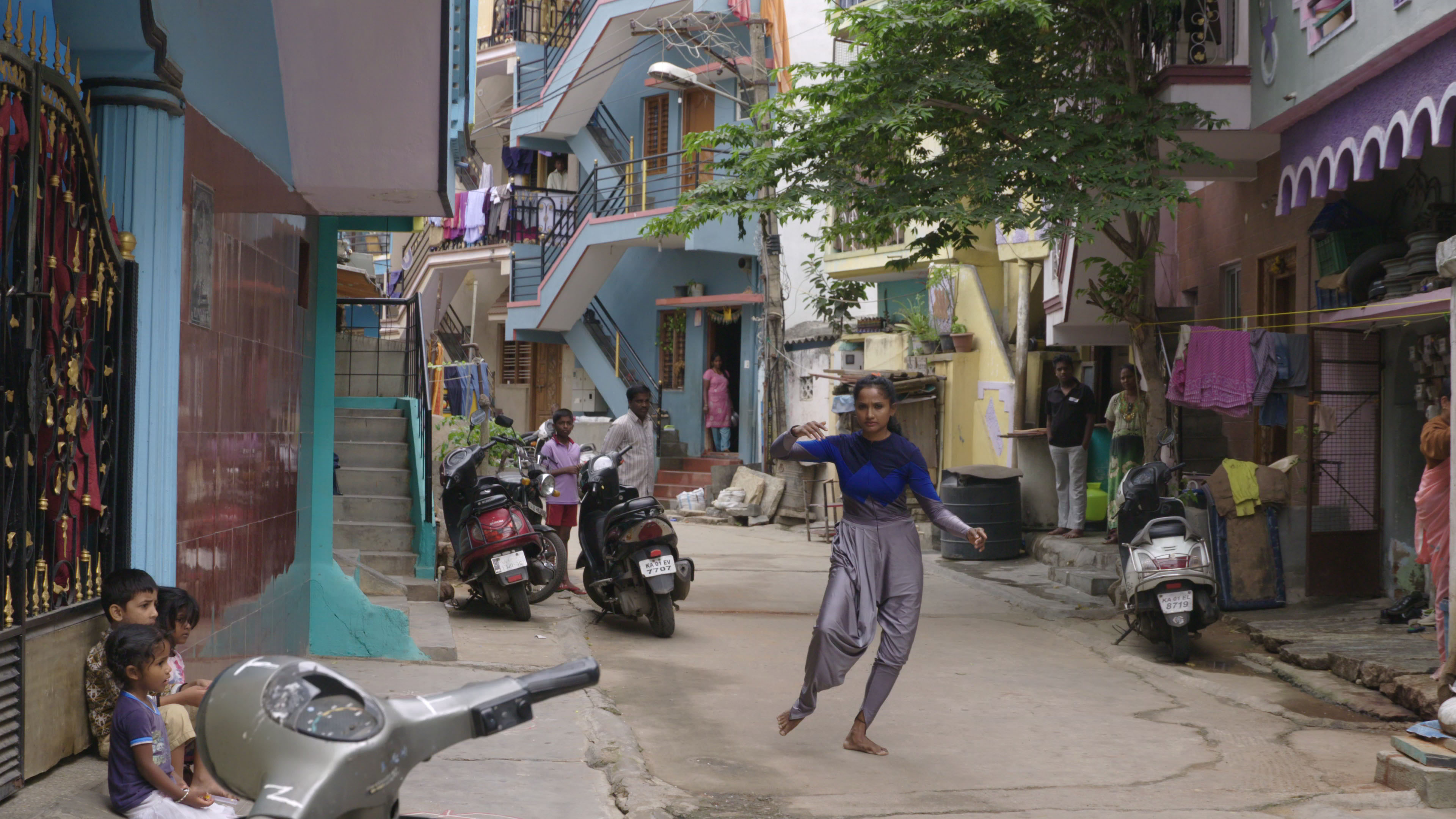 Dancer from the film A Small Dream, dancing in an Indian street. 