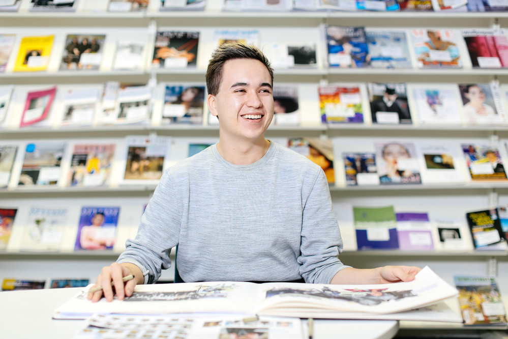 Student laughing in library