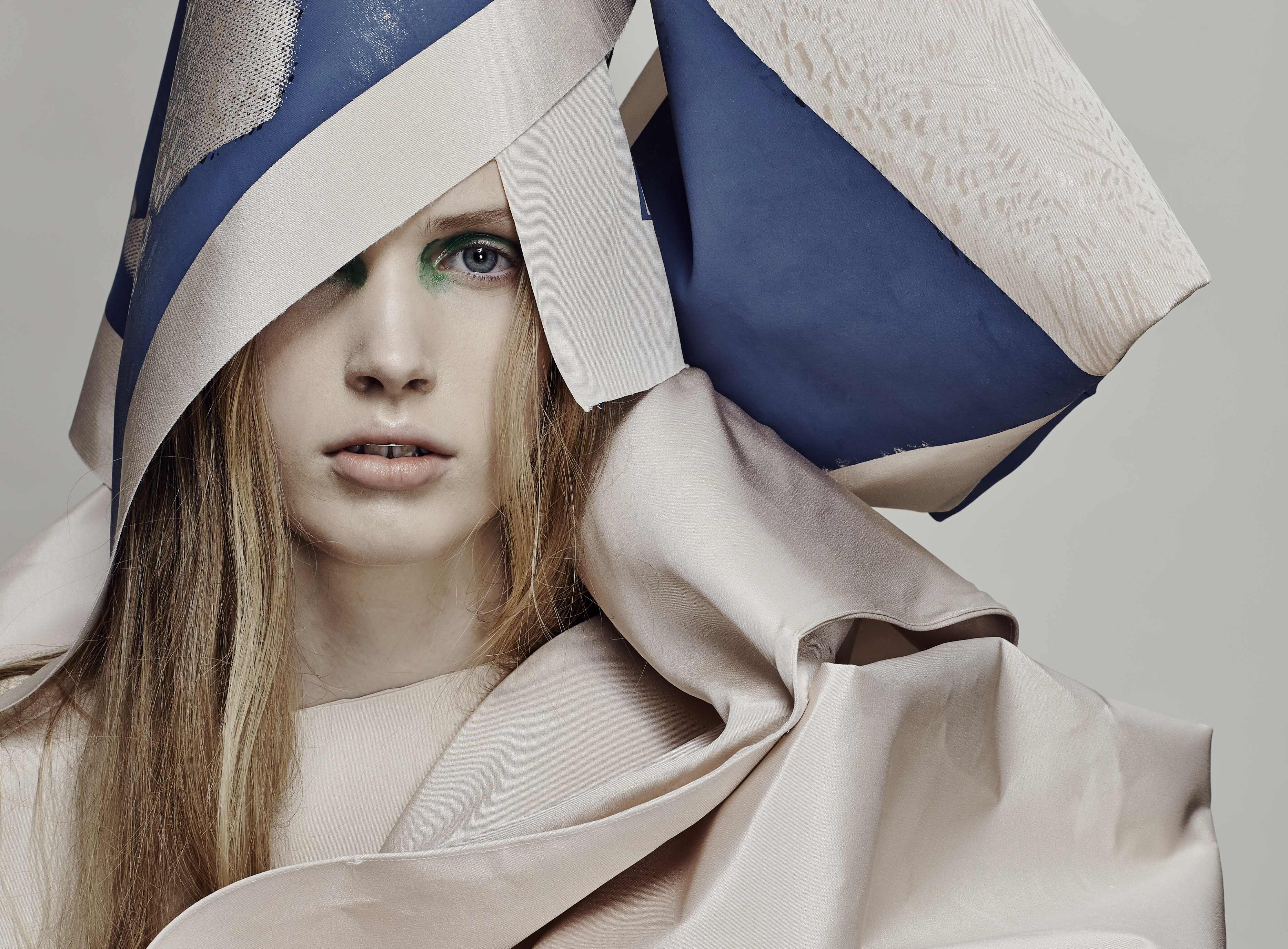 Female model in cream and blue material.