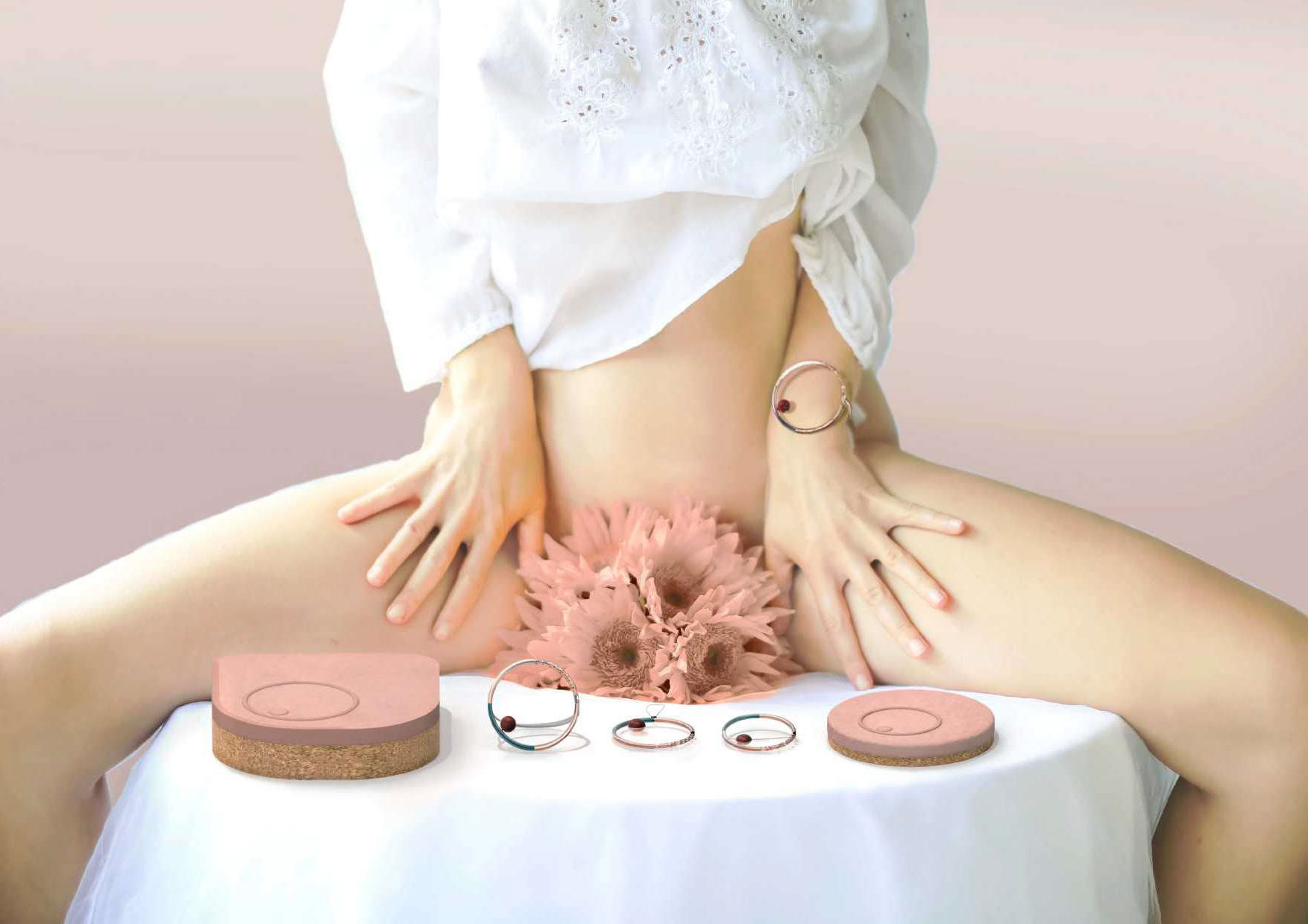 Figure of woman sitting on table surrounded by pink menstrual products (from Aneo by Ines Duplessis, MA Industrial Design)