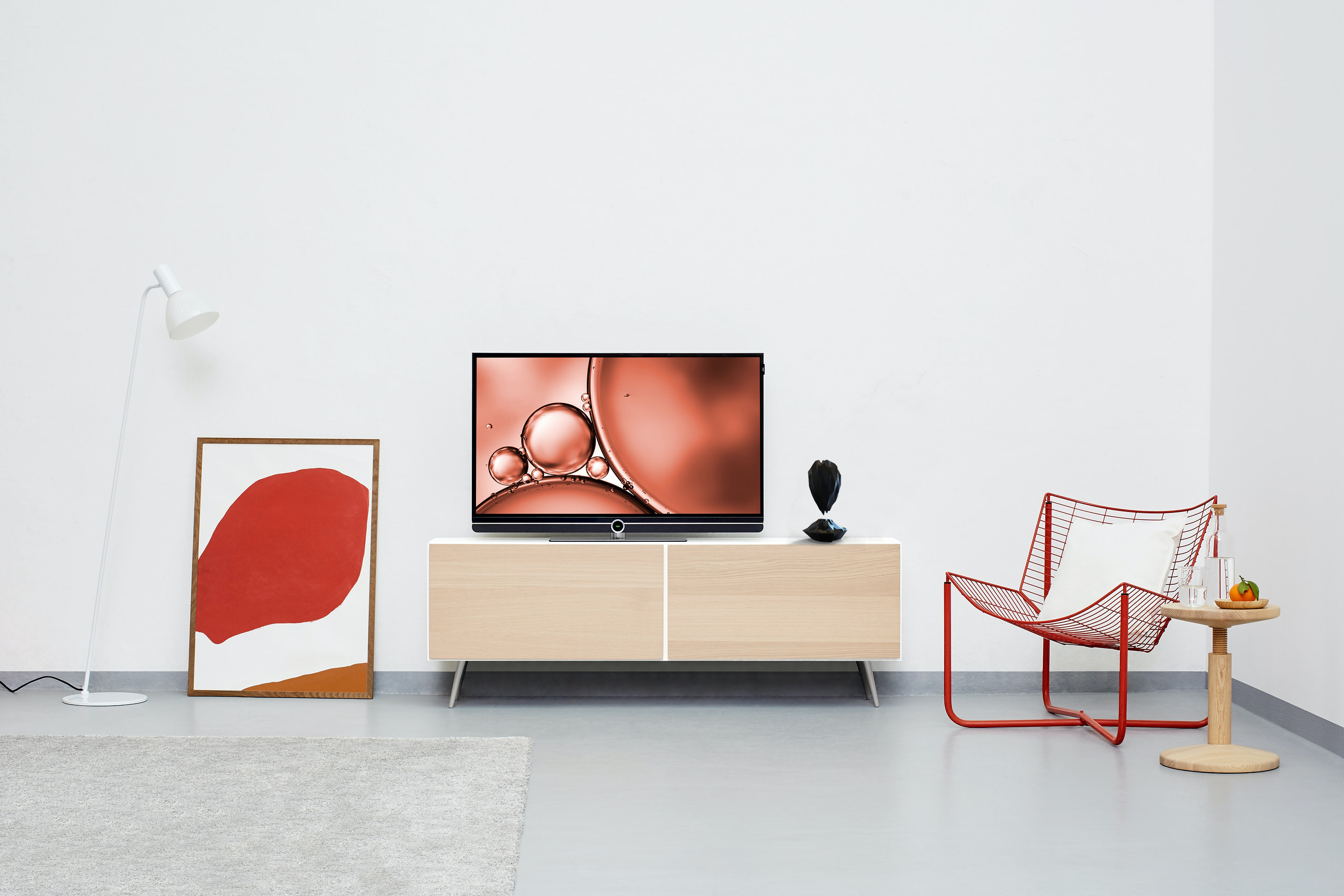 Black hovering crystal-shaped object set in living room