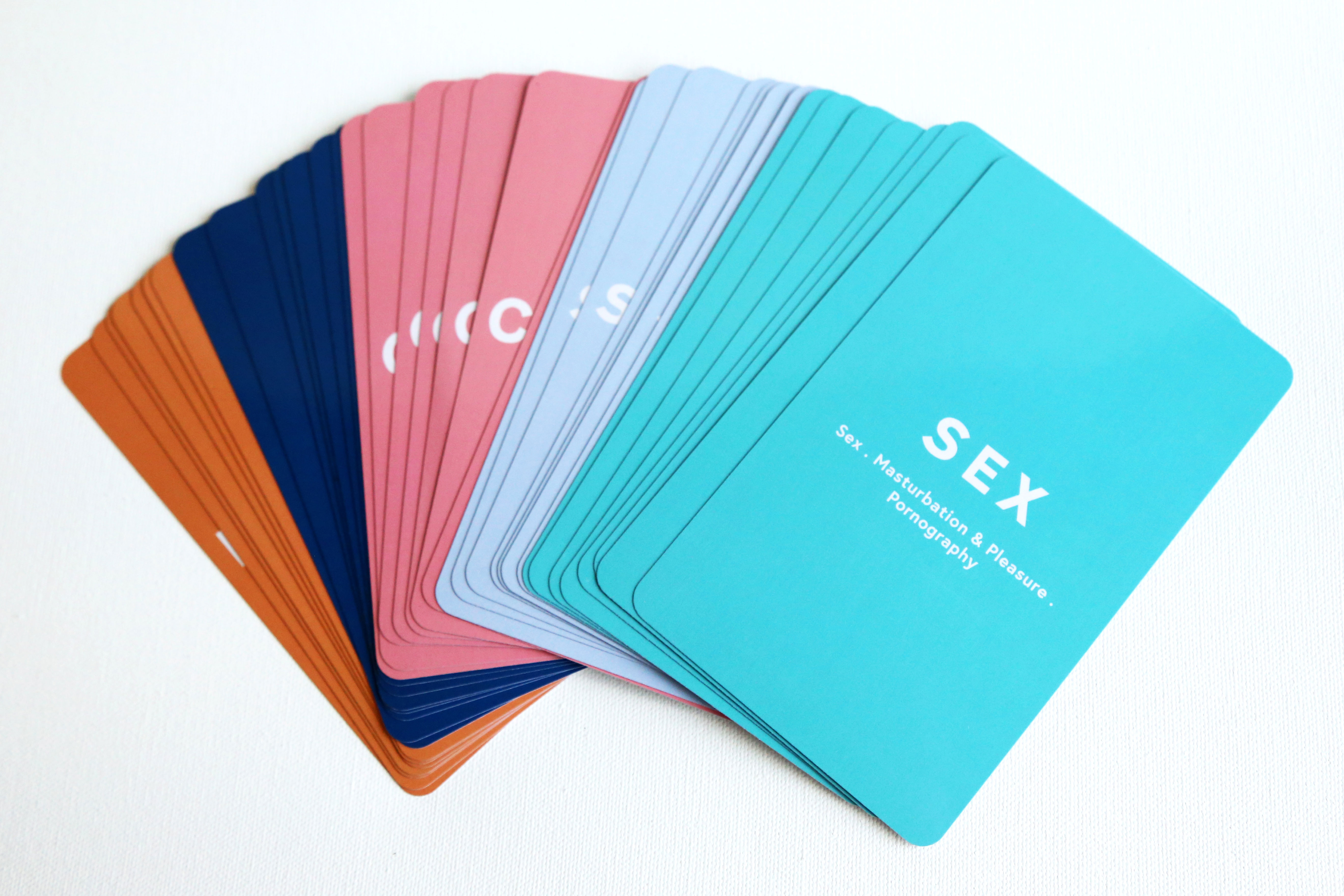 A series of coloured cards with prompts written on them