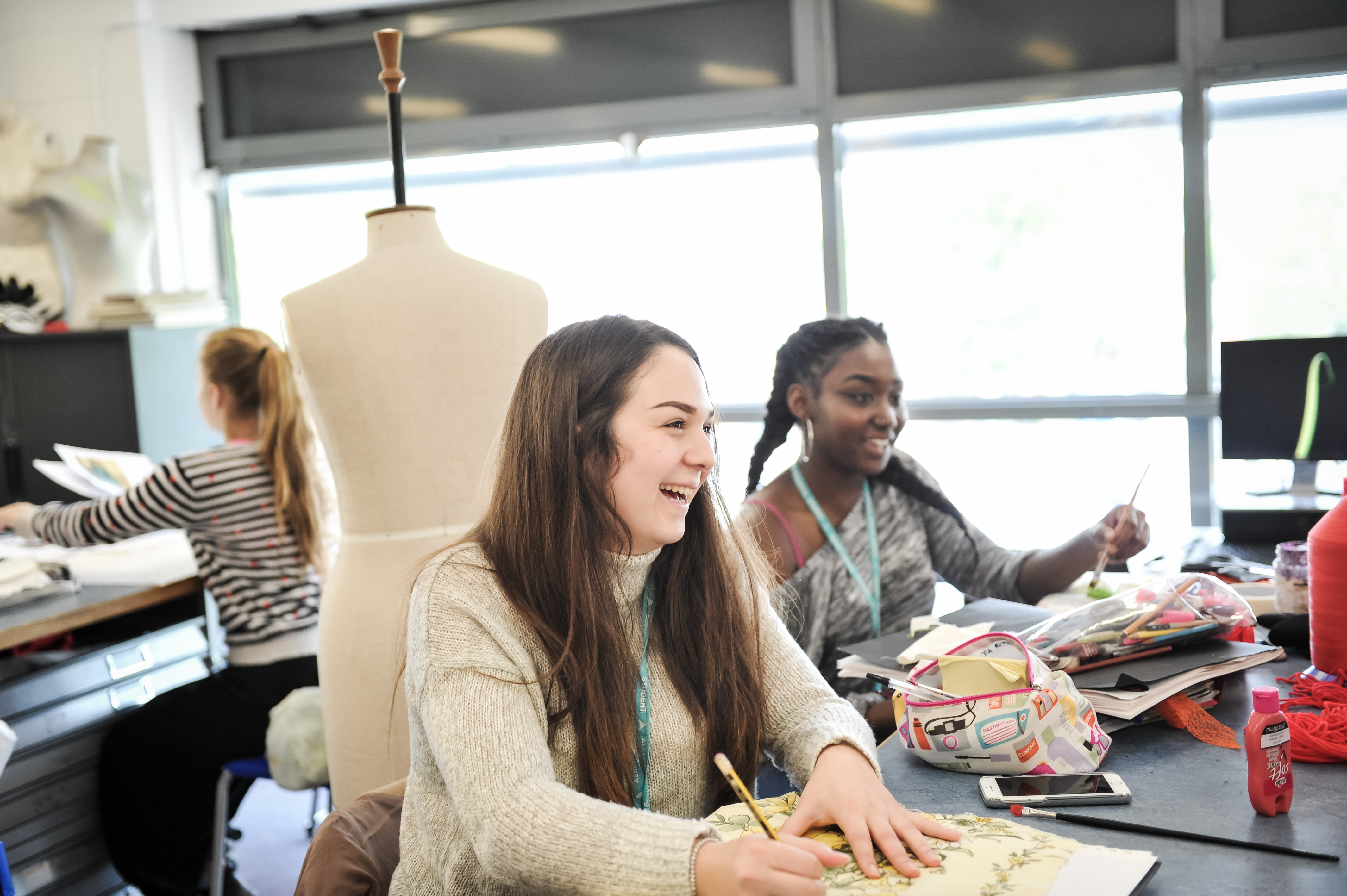 Girls in art studio laughing