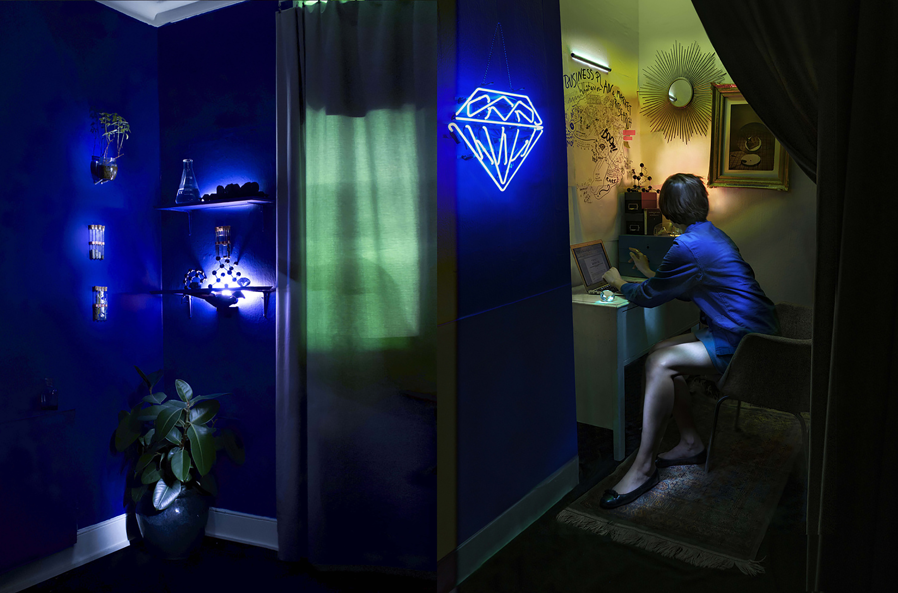 Female working in makeshift lab. Dark blue and neon lighting.