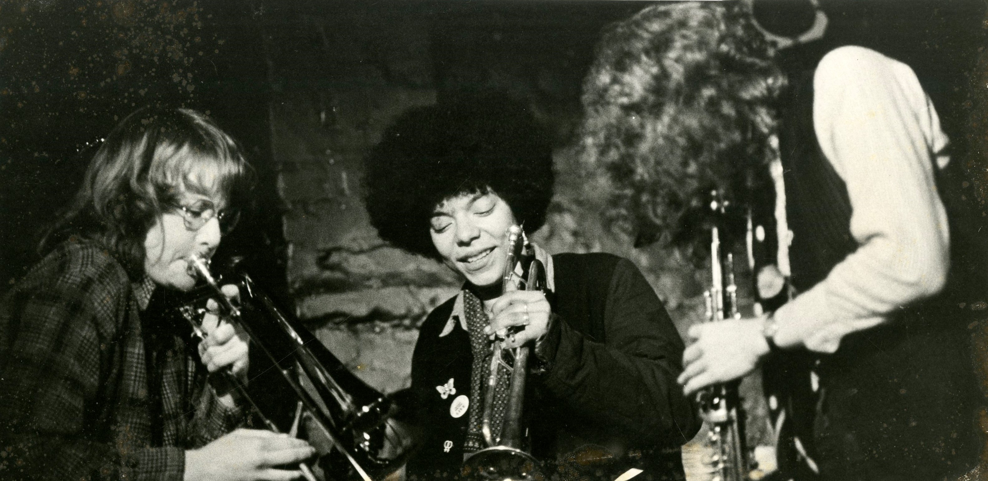 Black and white photograph of three female performers